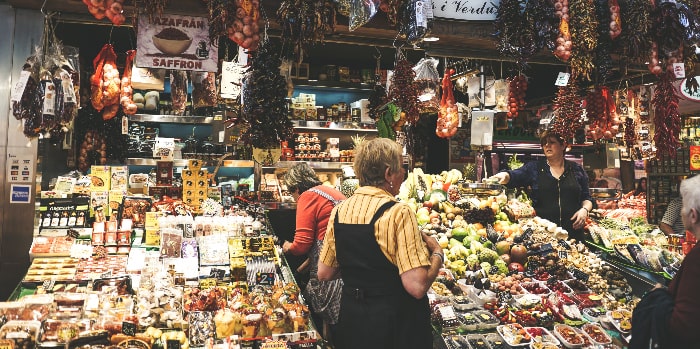 French food market filled with abundant fruits, vegetables, meats and cheeses. Many great choices for a healthy eating plan.